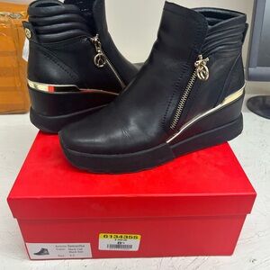 Stylish Black Wedge Boots with Gold Accents